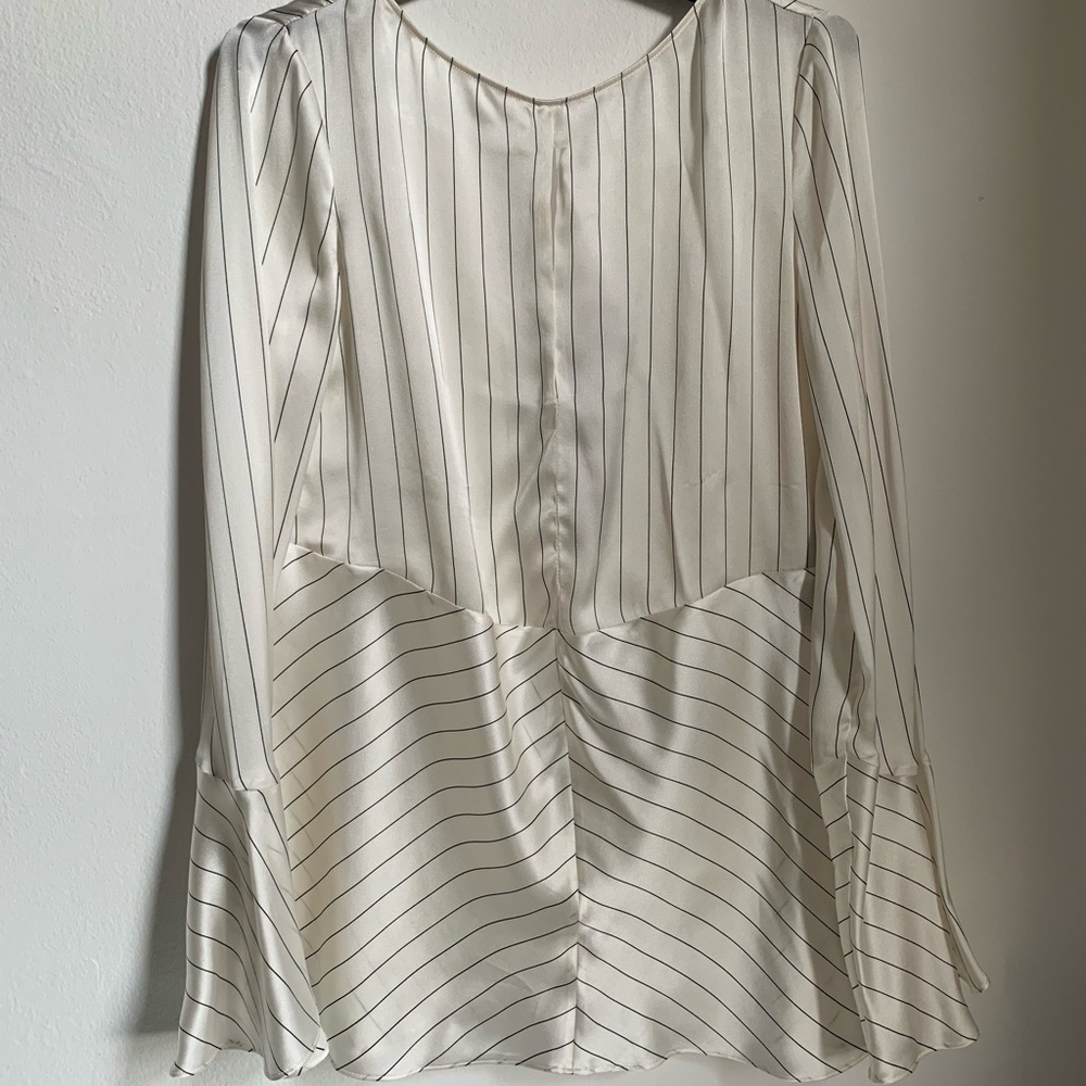 Beautiful blouse with cut back . Brand new
